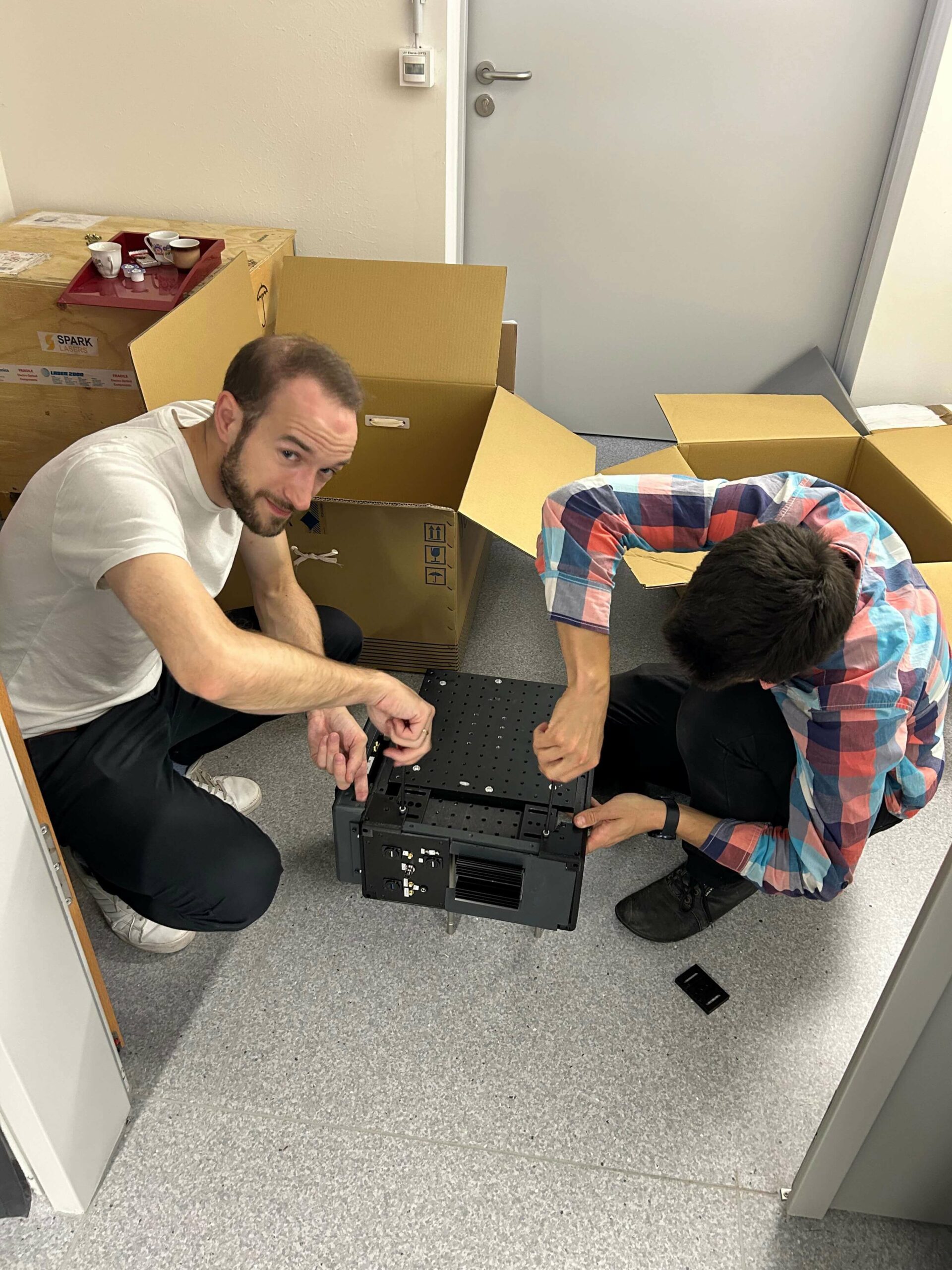DeepEn team preparing and assembling the DeepEn One endoscope system before its live demonstrations in 2023.