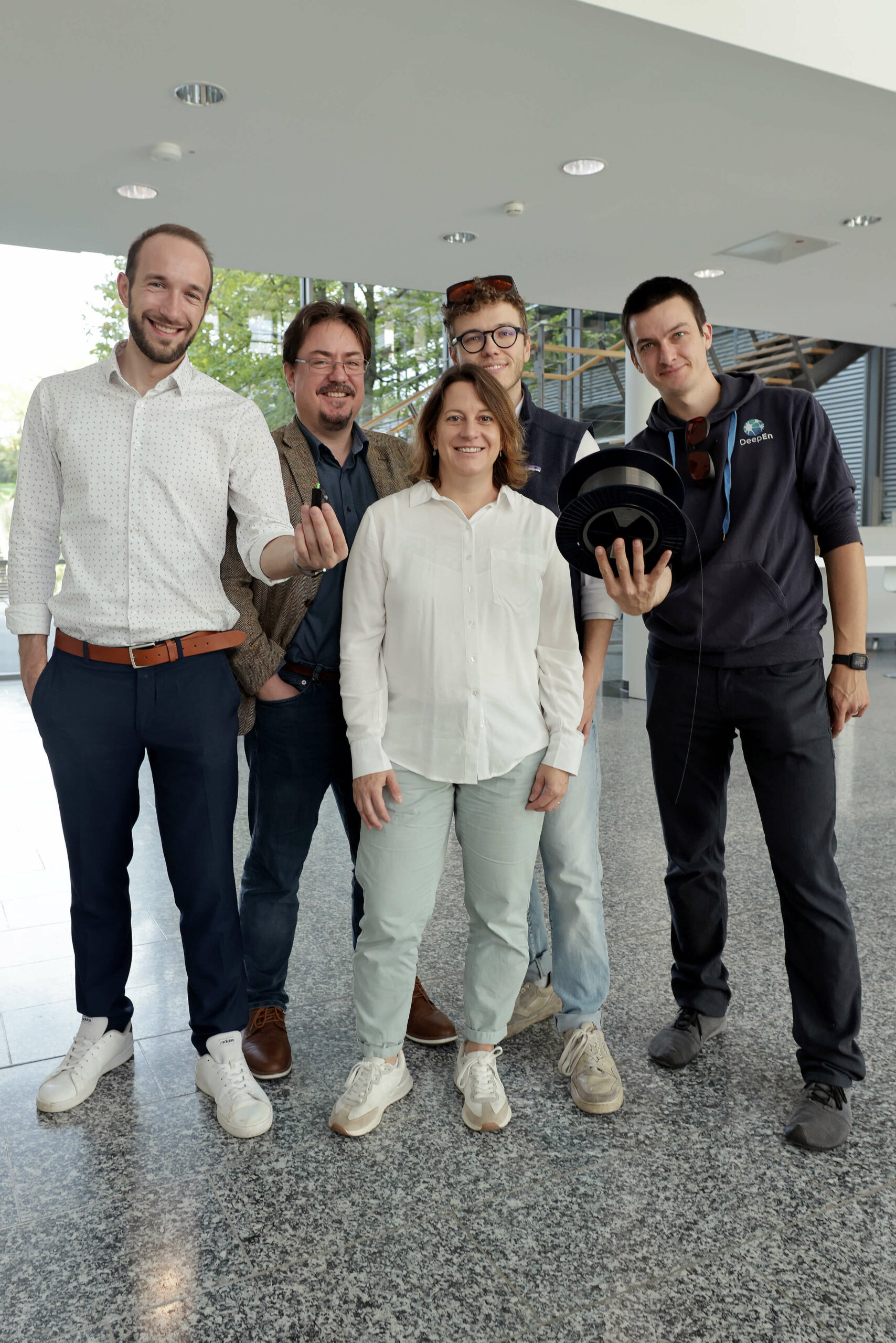 Group photo of the DeepEn team showcasing the single-fibre endoscope technology that secured new investment funding.