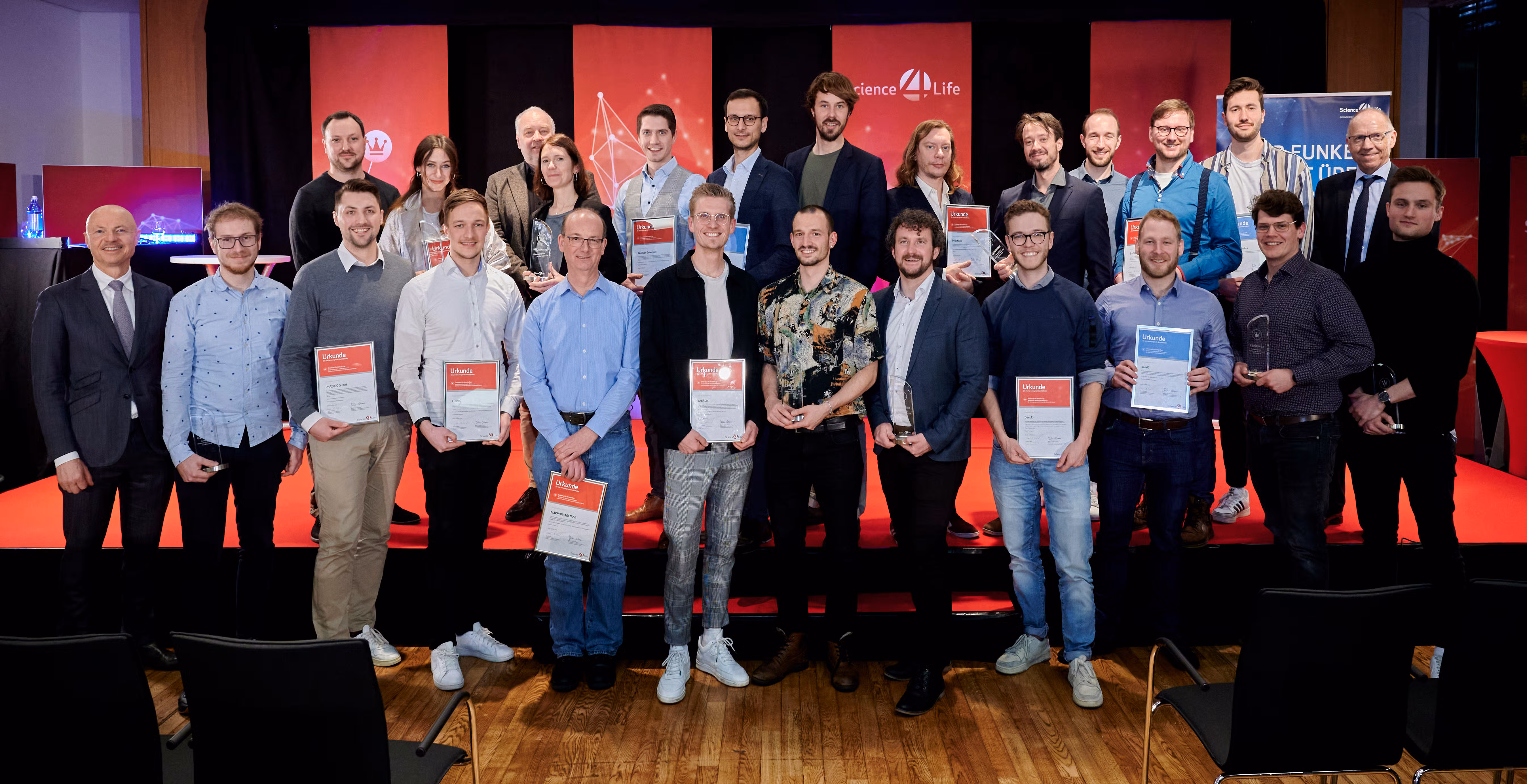 Group of start-up teams and organisers on stage at the Science4Life award ceremony, including DeepEn among the winners.