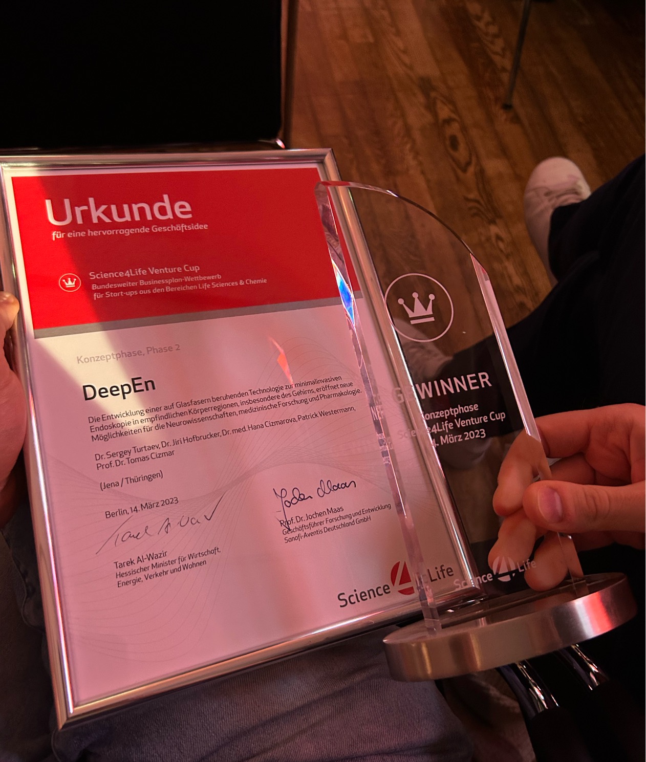 Close-up of the Science4Life Venture Cup certificate and trophy presented to DeepEn for their pioneering endoscope innovation.