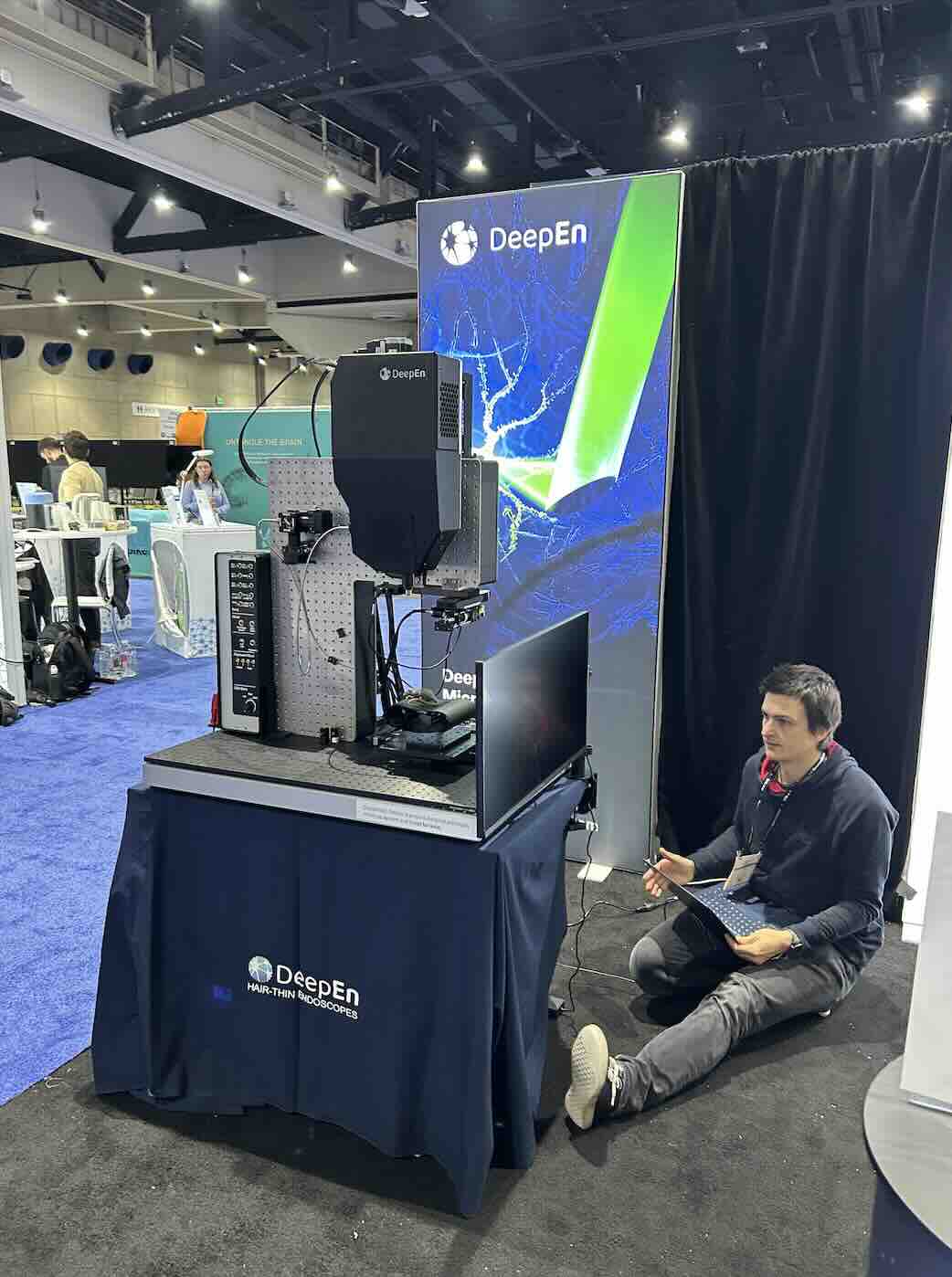 DeepEn One System Prototype displayed at a conference with an engineer working on it.