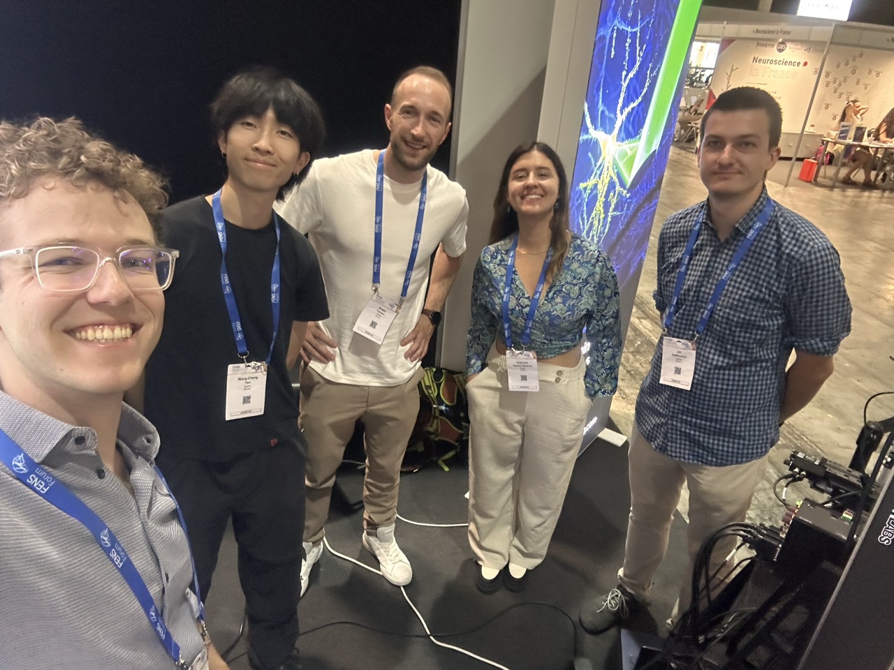 Five members of the DeepEn team at their exhibition booth during the FENS Forum 2026 in Barcelona.